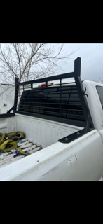 Custom black steel headache rack installed on a pickup