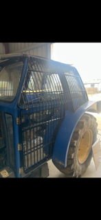 Finished expanded-metal tractor cab guard