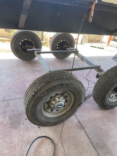 Trailer axle and wheel assembly during fit-up