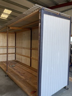 Finished utility trailer with enclosed side panels