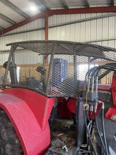 Fabricated protective guard installed on agricultural equipment